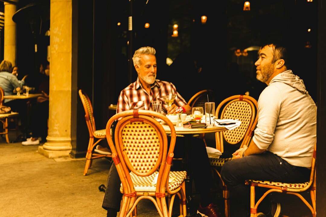 Mentor and mentee having a one on one conversation at a table